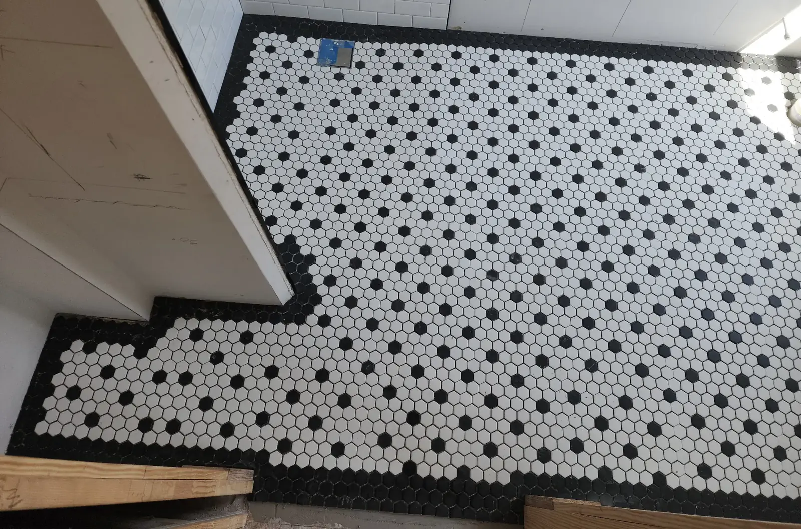 Black and white hexagon mosaic tile floor