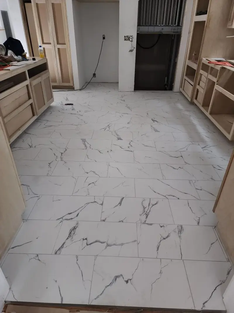 Large marble-look tile floor in a commercial build-out