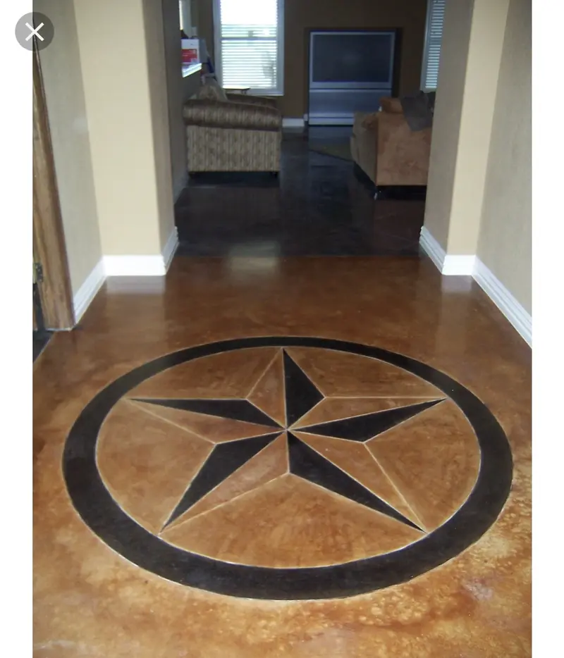Stained concrete floor with Texas star inlay
