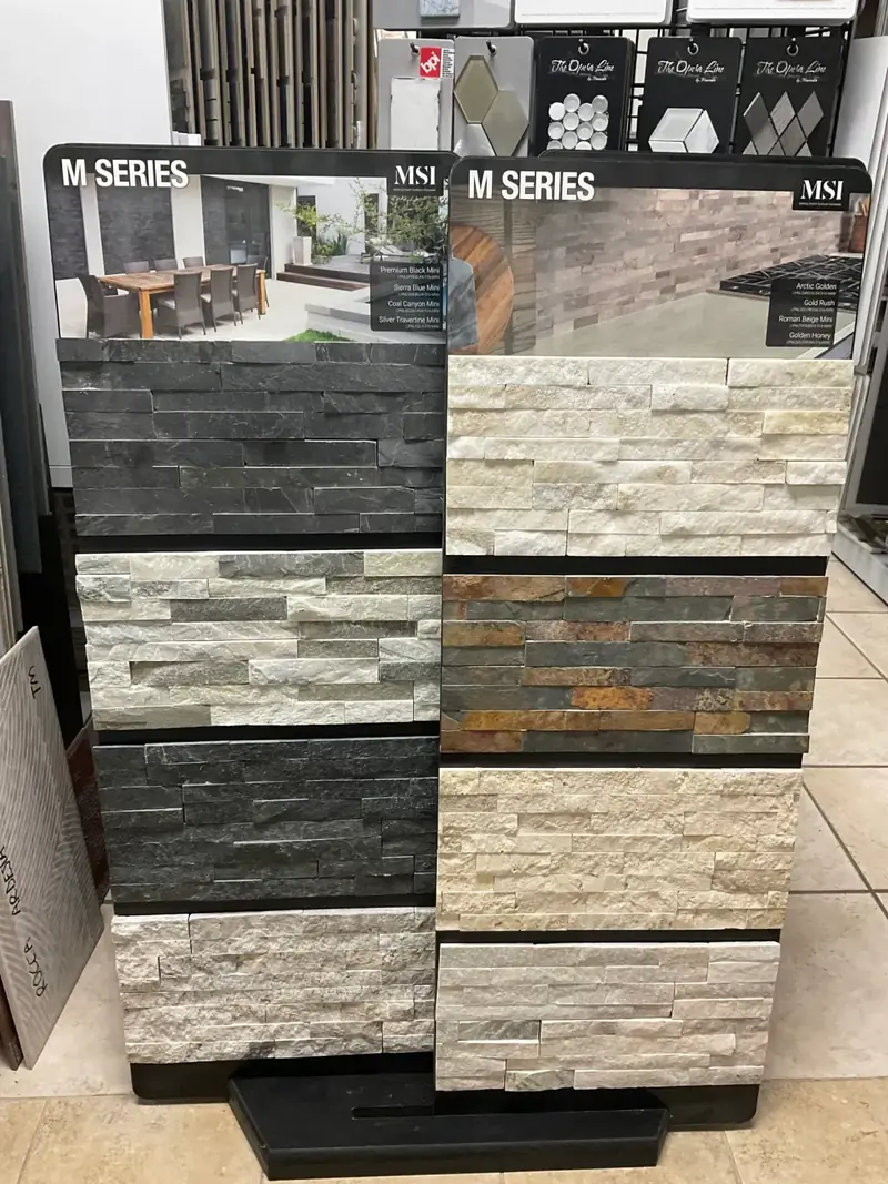 Stacked stone and ledger panel samples in the showroom